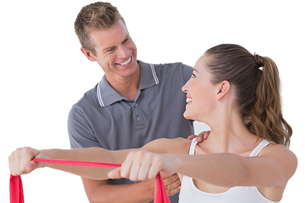 Smiling chiropractor helps patient rehab shoulder